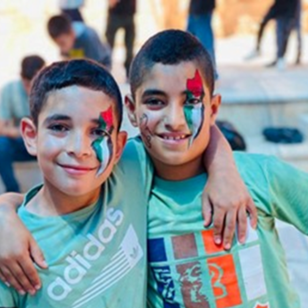 Boys with Palestinian map facepainted