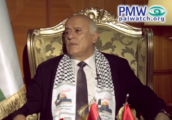 Jibril Rajoub wearing a scarf with a map erasing Israel
