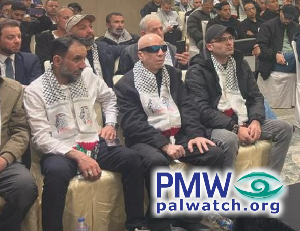 Prisoners wearing scarves with map of “Palestine”