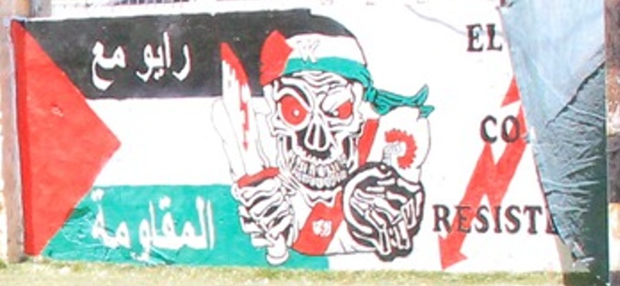 Skeleton holding a bloody knife and bomb with lit fuse