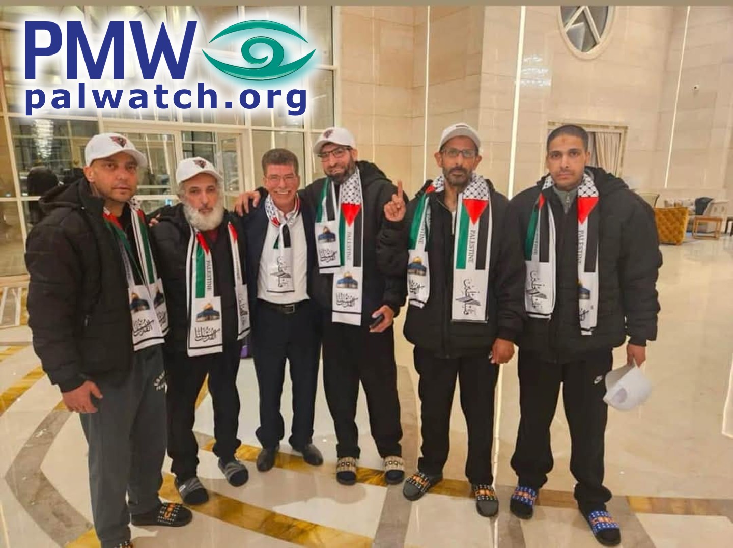 Qadura Fares posing with expelled terrorist murderers