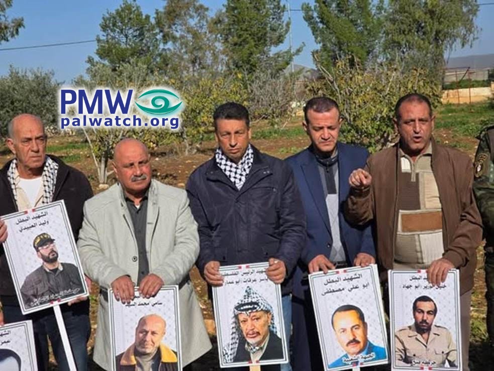 PA officials holding posters of terrorist murderers